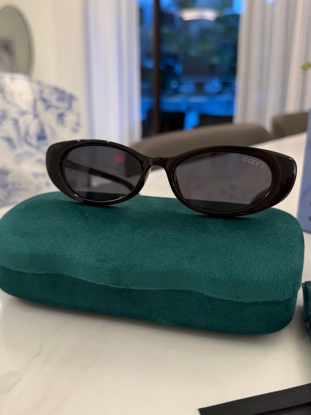 Gucci Black Oval Women's Sunglasses with Dark Lenses